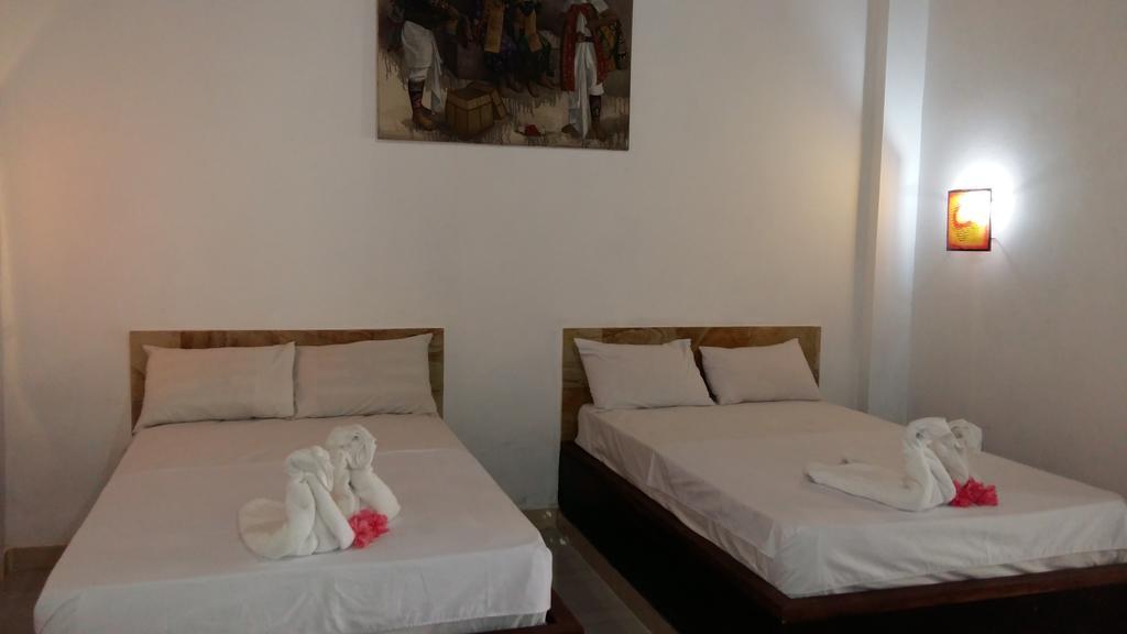 Amed Stop Inn Homestay, Rooftop Restaurant And Bar Екстериор снимка